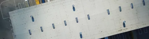 Aerial view of trucks loading at logistic center