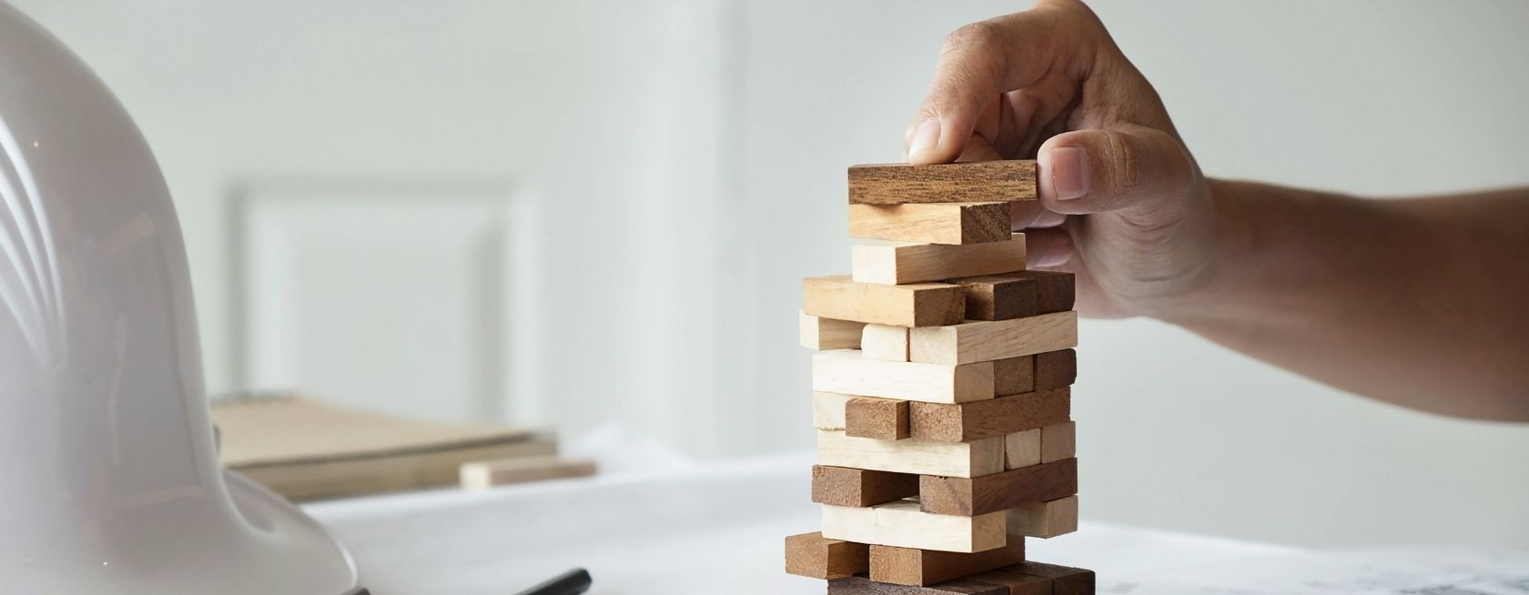 Engineer playing a blocks wood game