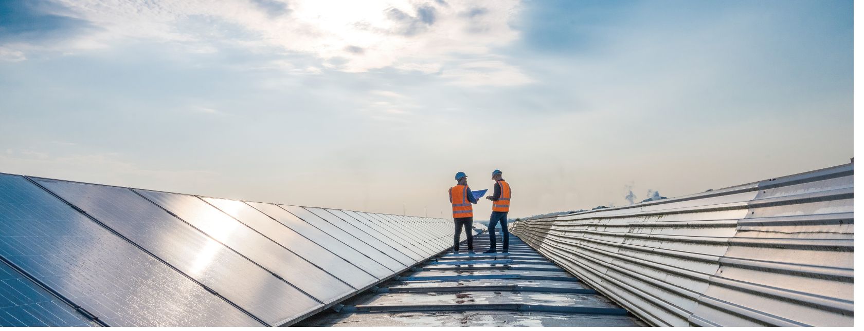 Energy auditor checking the roof for solar panels
