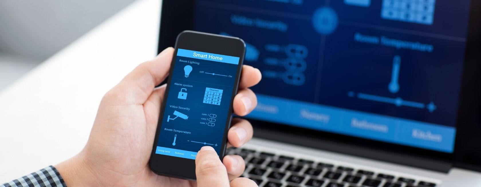 Man holding phone with program smart home on the screen