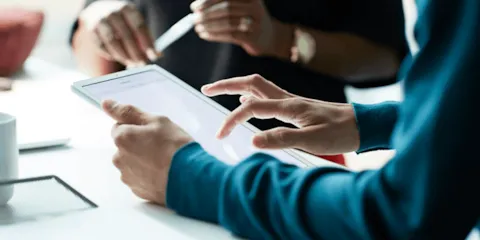 Man scrolling on a tablet
