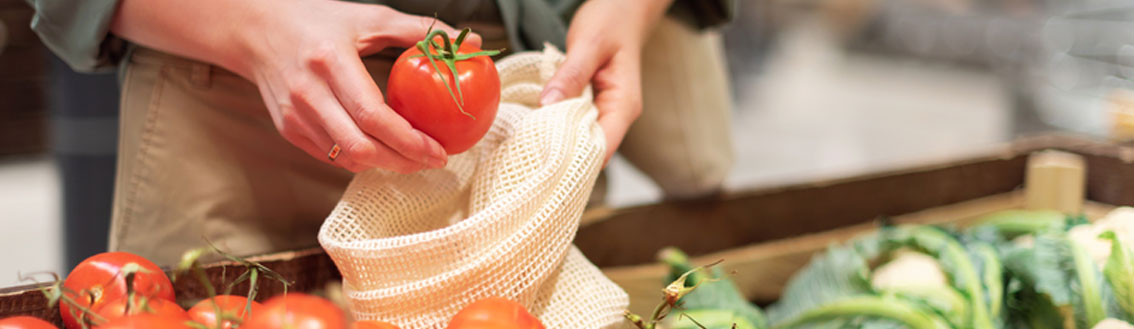 hands with red tomato